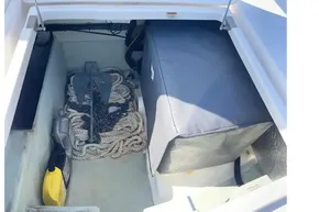 Storage compartment on a 2022 Leopard 45 boat with anchor and ropes.
