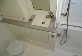 Compact bathroom in 2017 Leopard 45 yacht with sink, toilet, and shower.