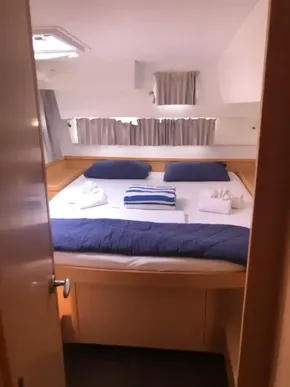2020 Lagoon 42 catamaran bedroom with cozy bedding and natural light.