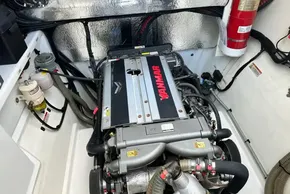 Engine room of 2022 Leopard 53 Powercat with Yanmar engine and fire extinguisher.