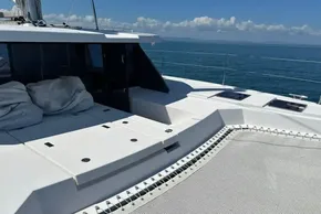 2022 Leopard 42 catamaran deck with netting, ocean view, and clear sky.