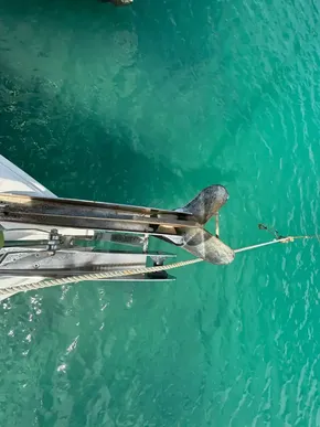 Anchor of Jeanneau Sun Odyssey 440 yacht in turquoise water, 2019 model.