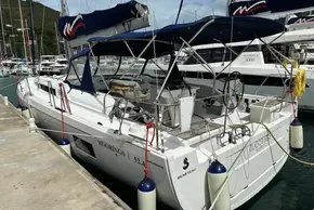 Beneteau Oceanis 51.1 yacht docked at marina, 2023 model, with blue canopy.