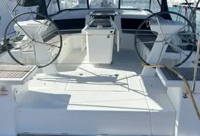2020 Beneteau Oceanis 46.1 yacht cockpit with dual steering wheels and canopy.