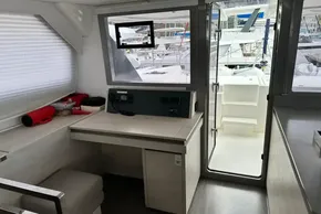 Interior of 2021 Leopard 50 yacht with navigation station and outdoor view.
