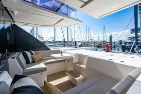 Luxurious Leopard 50 yacht interior with marina view, featuring comfortable seating and modern design, 2022 model.