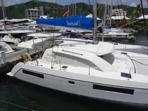 2021 Leopard 40 catamaran docked in marina, surrounded by other boats.