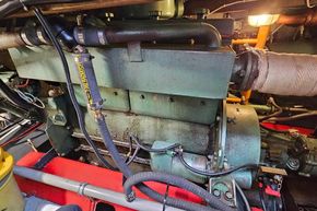 Engine room of a 1921 Classic Dutch Barge, showcasing vintage machinery and components.