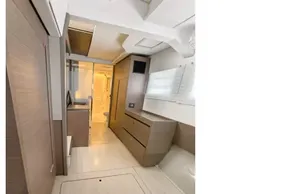Interior of 2021 Leopard 50 yacht, featuring modern wood cabinetry and sleek design.