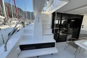 2024 Leopard 40 Powercat yacht interior with stairs and seating area in marina.