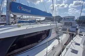 2022 Leopard 45 catamaran docked at marina under sunny skies.