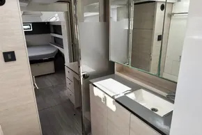 Modern interior of 2021 Leopard 50 yacht featuring bedroom and bathroom.