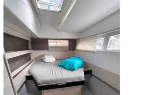 Cozy cabin interior of 2019 Leopard 50 yacht with bed and skylight.