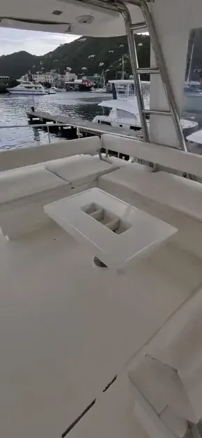 2019 Leopard 51 Powercat yacht with spacious seating area and scenic marina view.