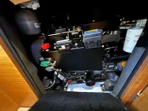 Engine compartment of 2019 Jeanneau Sun Odyssey 440 sailboat, showcasing mechanical components.