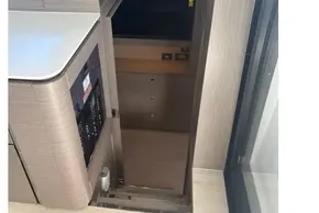 Modern interior of 2025 Leopard 46 yacht with sleek cabinetry and hidden storage.