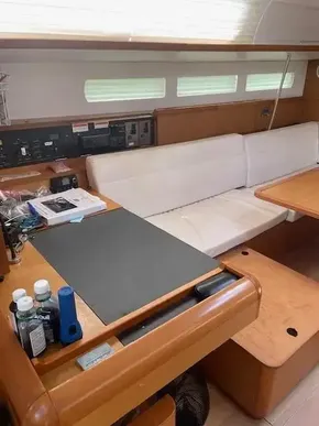 Interior of 2017 Jeanneau Sun Odyssey 519 sailboat with navigation station and seating area.