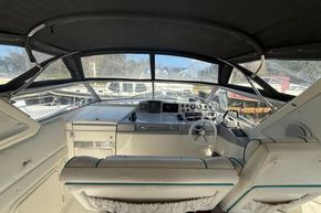 Interior view of 1991 Sealine 290 Ambassador boat cockpit with steering wheel and controls.