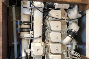 Engine compartment of a 1989 Princess 35 Flybridge yacht, showcasing mechanical components.