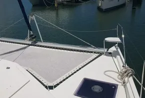 Leopard 48 catamaran 2017 model with netting on deck, docked in marina.