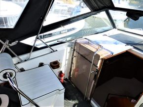 Interior view of a 1995 Aquafibre Bounty Boats 10/70, featuring seating and helm area.