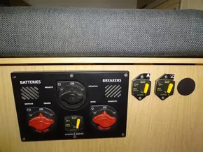 Control panel of a 2017 Beneteau Oceanis 45 sailboat, featuring battery and breaker switches.