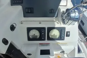 Control panel of a 2022 Leopard 45 yacht with gauges and throttle.