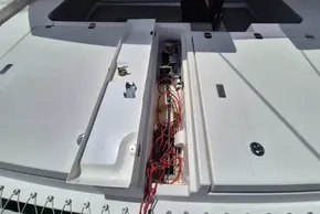 Leopard 45 yacht deck with open hatch, revealing red wiring and mechanical components.