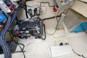 Engine room of a 2019 Leopard 50 yacht, showcasing wiring and mechanical components.