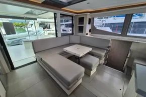 Modern interior of a 2020 Leopard 45 yacht with sleek seating and large windows.