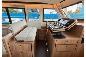 Interior of 2025 Linssen 45 SL Sedan yacht with modern helm and seating area.