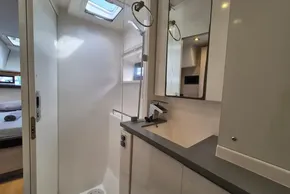 Modern bathroom interior on a 2020 Leopard 45 yacht, featuring sleek fixtures and ample lighting.