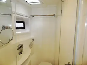 2015 Leopard 51 Powercat bathroom with modern fixtures and a small window.