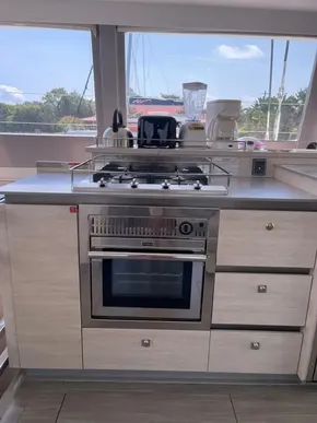 Modern kitchen in a 2020 Leopard 50 yacht with stove and oven.