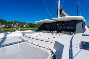 Luxury Leopard 50 catamaran, 2022 model, with spacious deck and sleek design under clear blue sky.