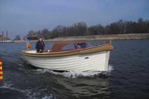 Enkhuizensloep 780 boat cruising on a calm river, 2026 model.