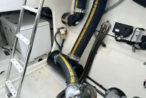 Engine room of 2025 Robertson and Caine Leopard 46 Powercat with visible machinery and piping.