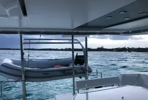 Leopard 45 catamaran with dinghy on davits, ocean view, 2020 model.