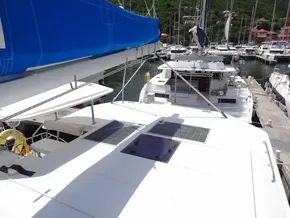 Leopard 40 catamaran, 2021 model, docked in marina with solar panels and blue sail cover.