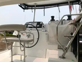 Lagoon 42 catamaran helm station, 2020 model, featuring steering wheel and navigation controls.