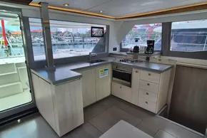 Modern kitchen interior on a 2021 Leopard 45 yacht, featuring sleek countertops and appliances.
