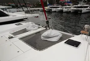 Lagoon 42 catamaran 2020 model docked in a marina with other boats.