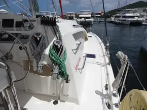 Sailing yacht Leopard 40, 2021 model, docked in a marina with clear skies.