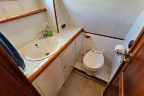 Bathroom interior of 2005 Stevens 1200 Vlet yacht with sink and toilet.