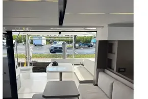 Luxurious interior of 2025 Leopard 46 yacht with modern seating and outdoor view.