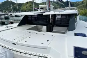 2021 Leopard 50 catamaran docked in a marina with scenic mountain backdrop.