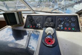 Control panel of a 1989 Princess 35 Flybridge yacht, featuring gauges and navigation equipment.