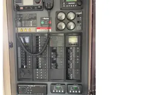 Electrical control panel on a 2022 Leopard 45 yacht, featuring gauges and switches.