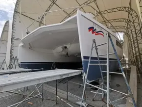 2015 Leopard 51 Powercat undergoing maintenance in a covered dry dock.