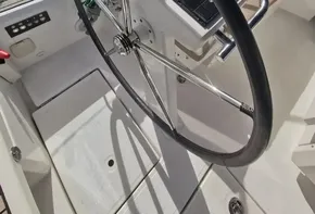 Beneteau Oceanis 46.1 yacht steering wheel, 2020 model, docked at marina.